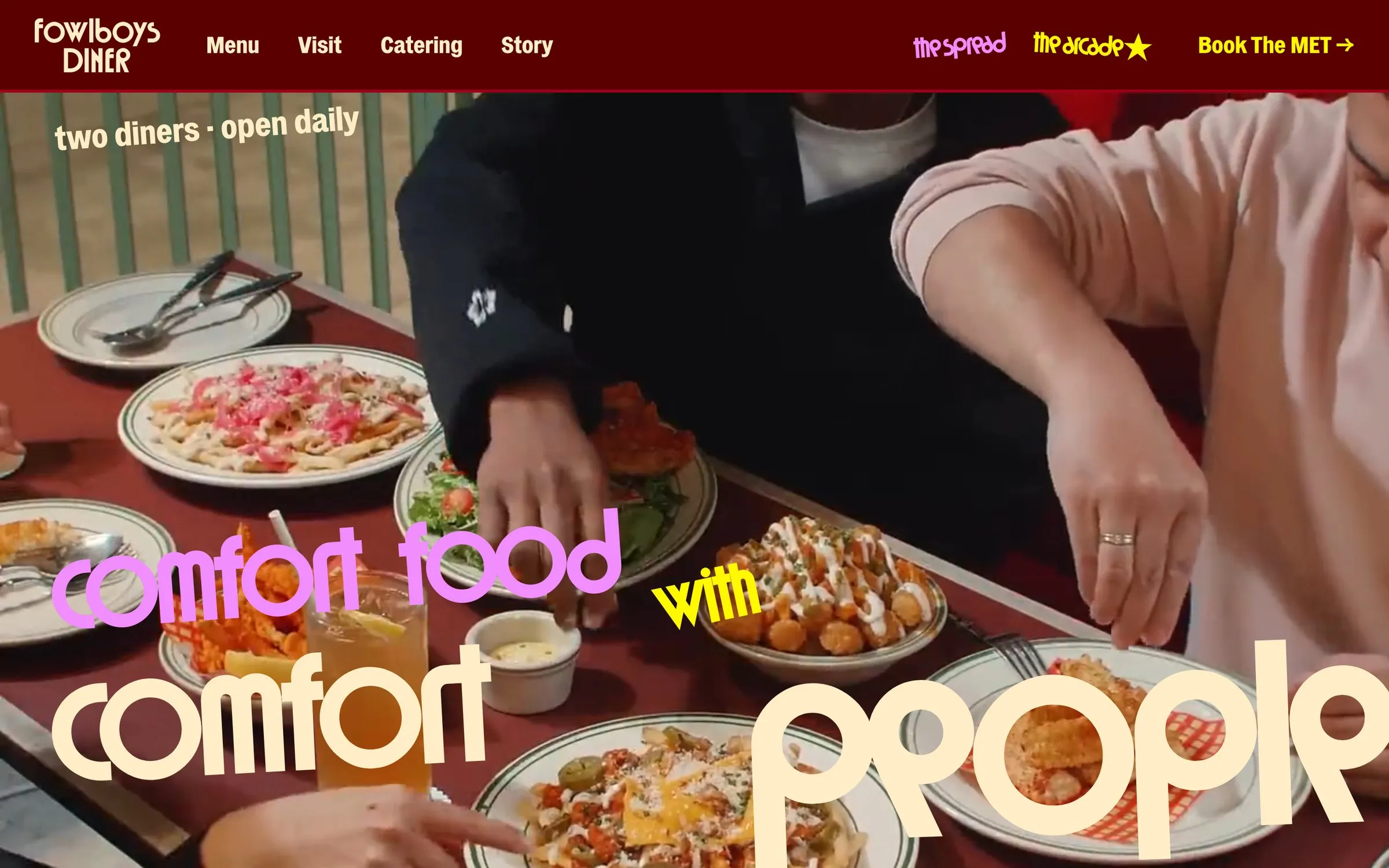 The fowlboys.com home page, a table of diner food under the words comfort food with comfort people